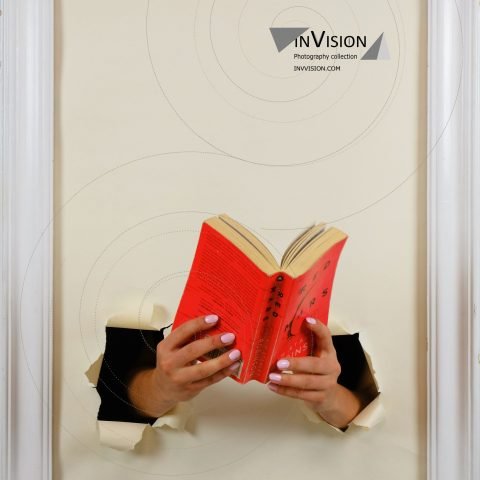 hands out of the painting with book